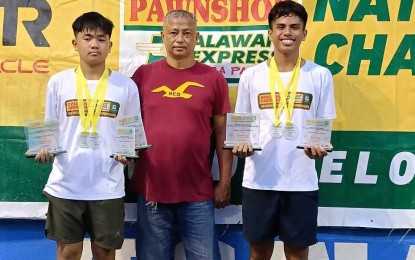 <p><strong>MVP.</strong> Anthony Bjorn Castigador (left) pocketed four titles at the Palawan Pawshop National Juniors Tennis Championship at the Iloilo City Sports Academy hard courts on Monday (Sept. 2, 2024). Also in the photo are doubles partner Rizzjun Miles Labindao and Iloilo City Sports Academy coach Alvin Santiago <em>(Contributed photo) </em></p>