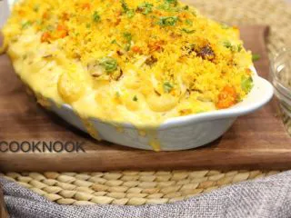 起司螃蟹通心粉,取出后 撒上碎的西洋芹 淋上橄榄油 放上装饰用的蟹壳