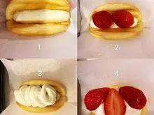 韩式—草莓蛋糕卷,接下来,开始组合,装饰蛋糕~ 1.先在蛋糕卷内挤第一层鲜奶油。 2.第二层放切对半的草莓。 3.第三层再挤上鲜奶油。 4.第四层再点缀上草莓,洒上糖粉,完成