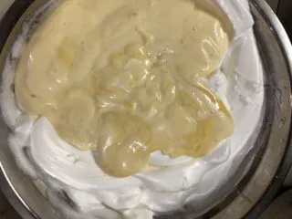 十寸戚风蛋糕（不开裂）,倒入剩下的蛋白霜中翻拌均匀